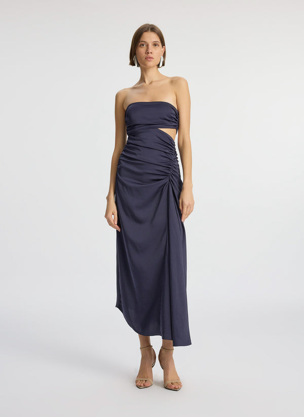 front view of woman wearing navy blue strapless midi dress