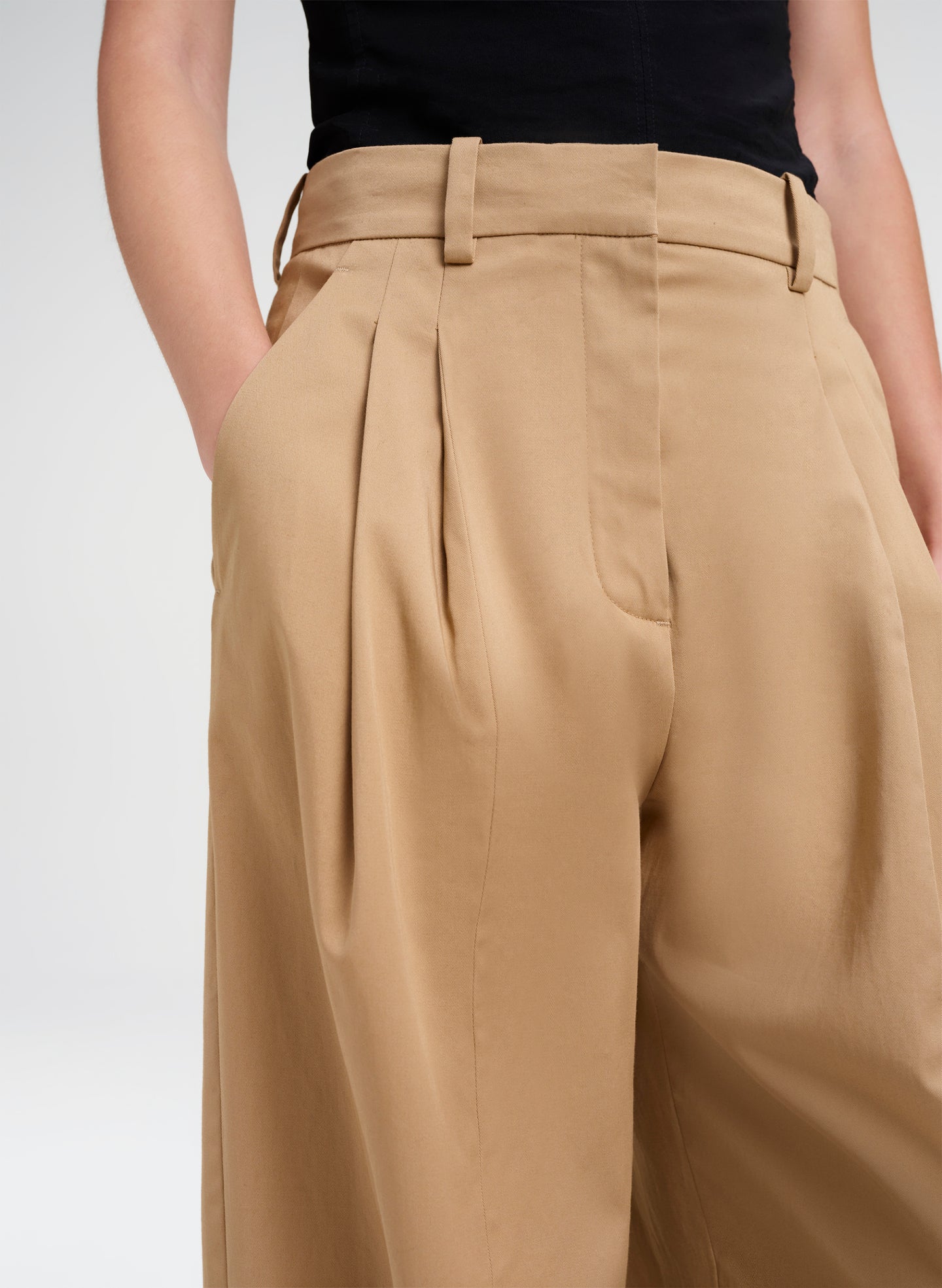 woman wearing tan pants