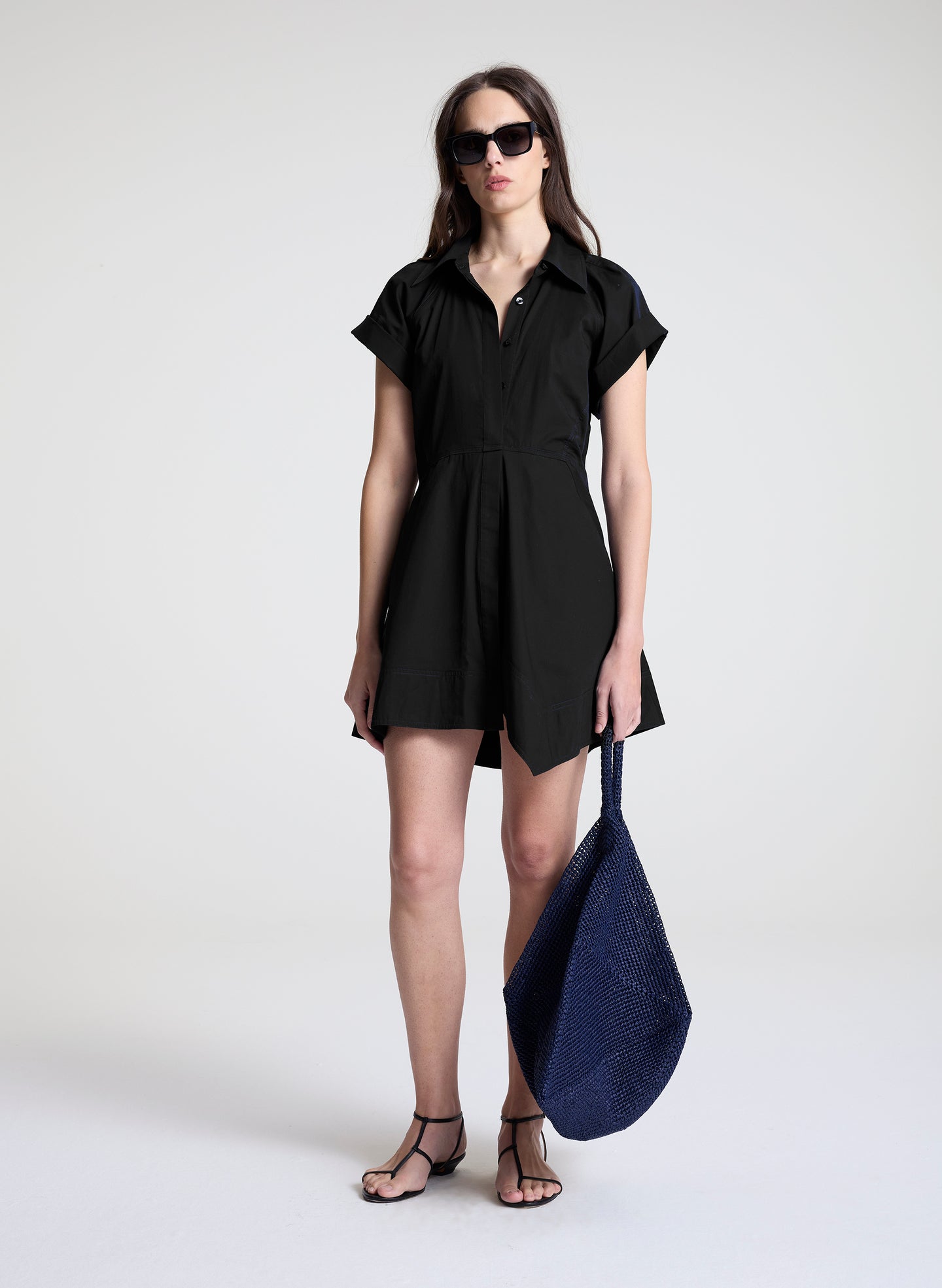 woman wearing black mini shirt dress