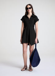 woman wearing black mini shirt dress