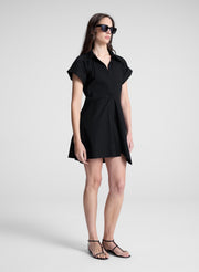 woman wearing black mini shirt dress