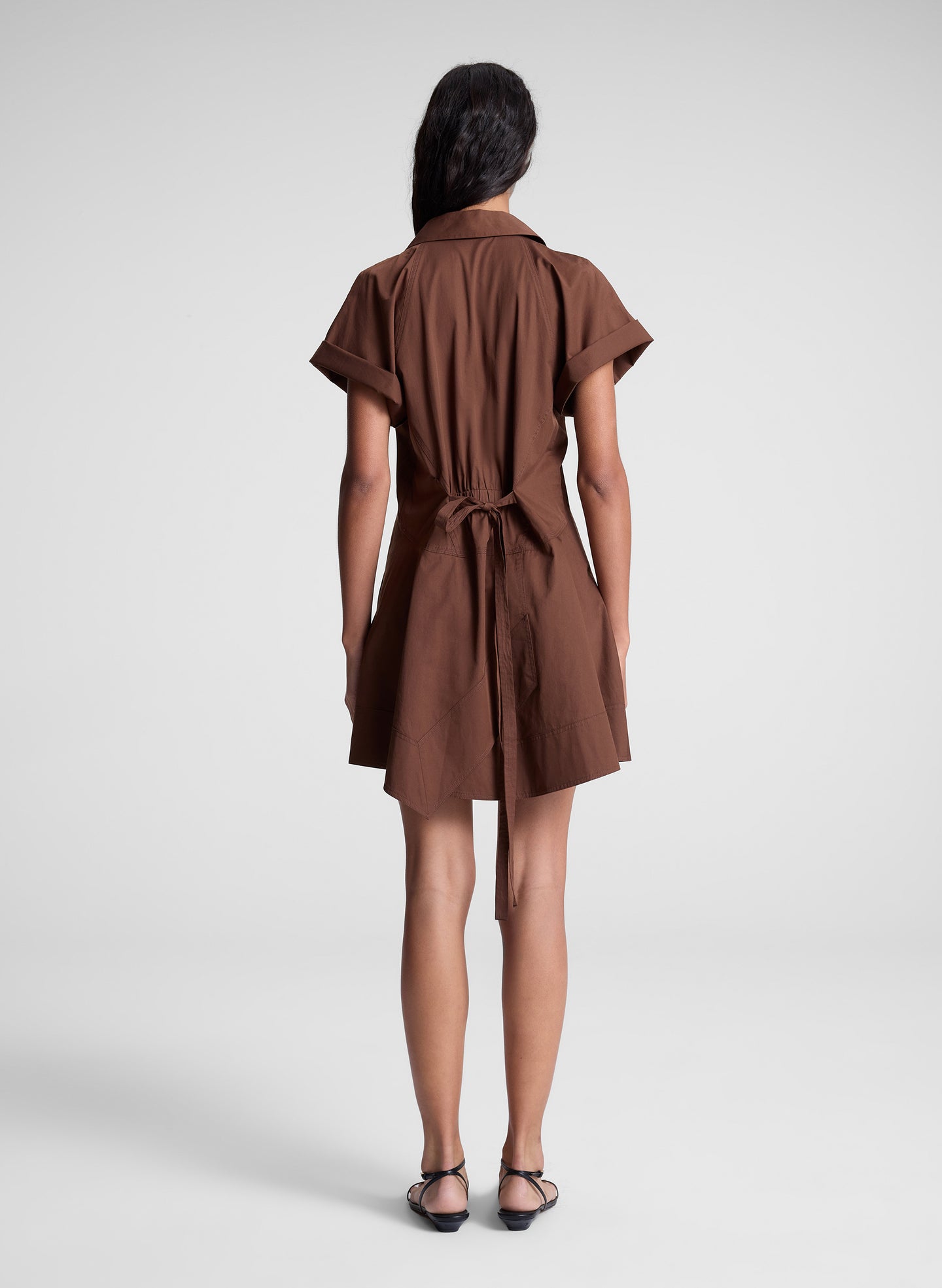 woman wearing brown mini shirt dress
