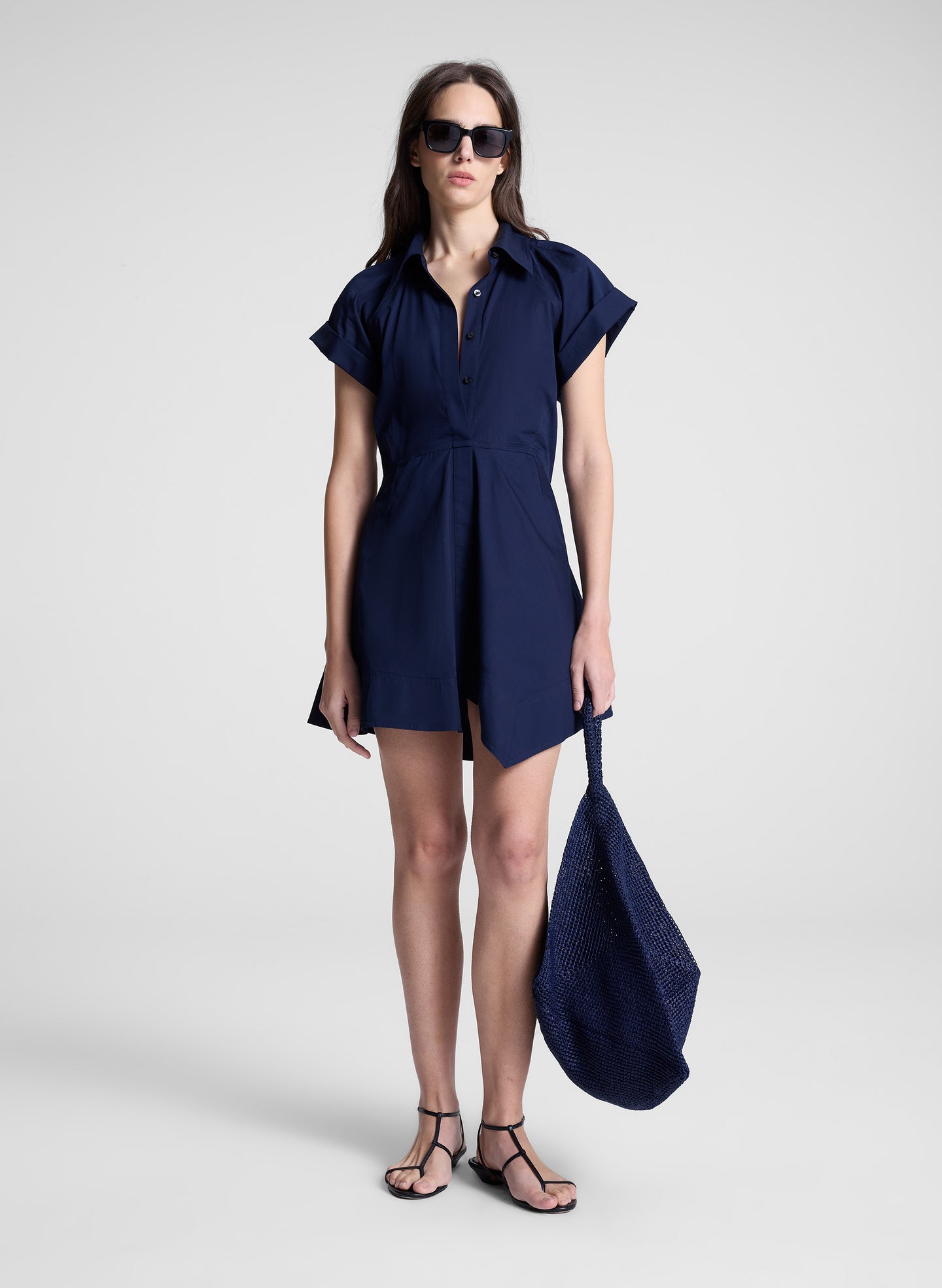 woman wearing navy blue mini shirt dress
