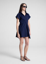 woman wearing navy blue mini shirt dress