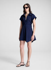 woman wearing navy blue mini shirt dress