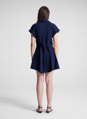 woman wearing navy blue mini shirt dress