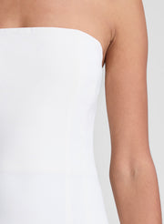 woman wearing white strapless drop waist midi dress