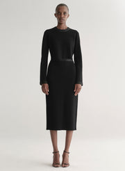 woman wearing black top and black skirt