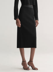 woman wearing black top and black skirt