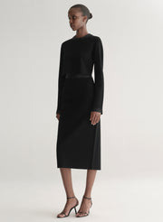 woman wearing black top and black skirt