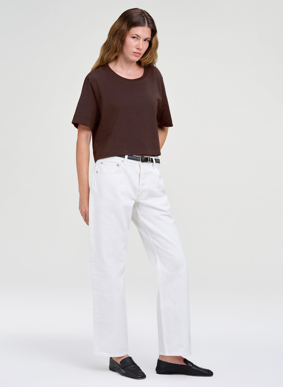 woman in brown tshirt and white denim