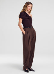 woman wearing merino top and brown pants