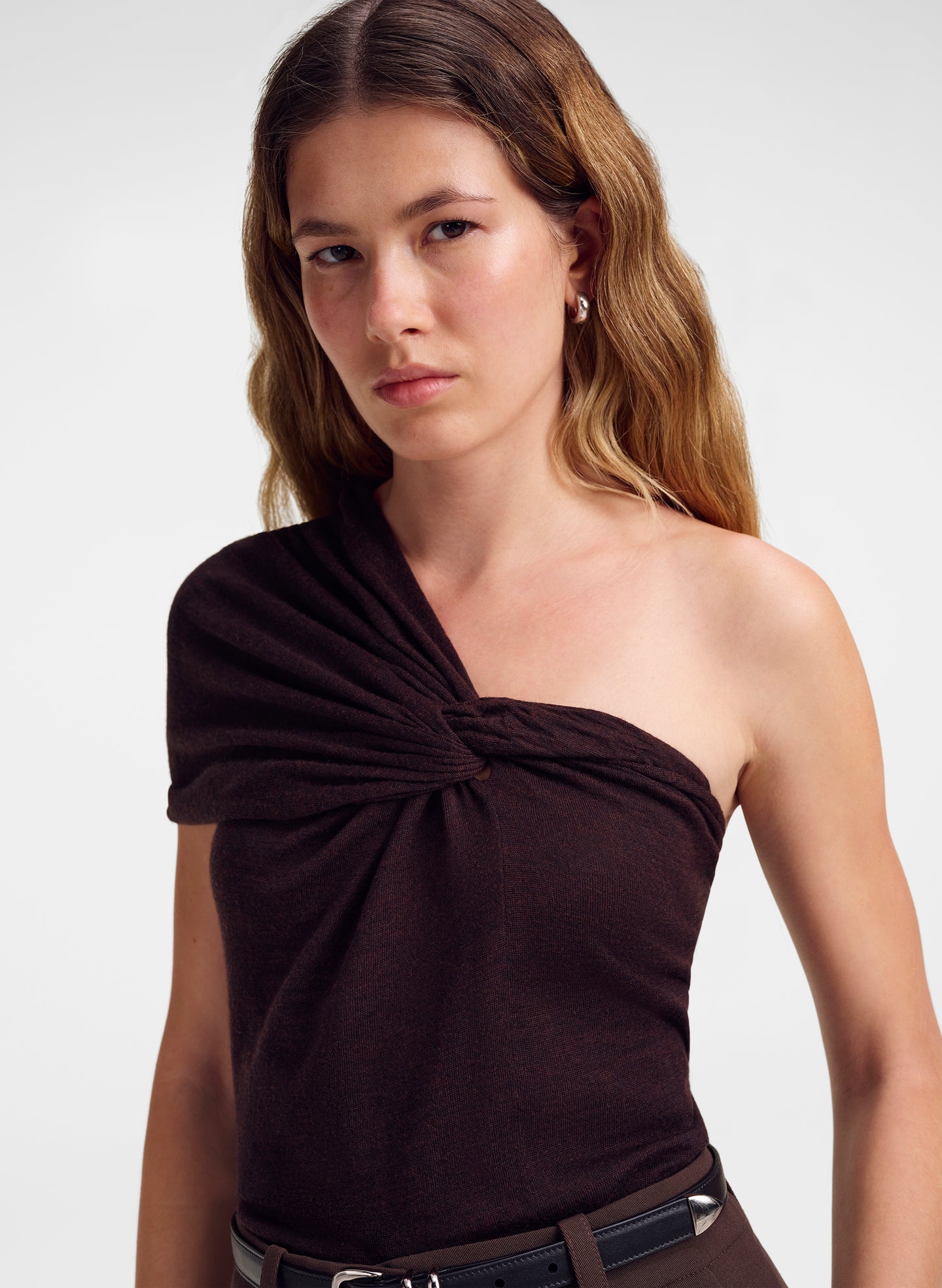 woman wearing brown one shoulder merino top