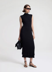 woman wearing black fine gauge voile knit midi dress