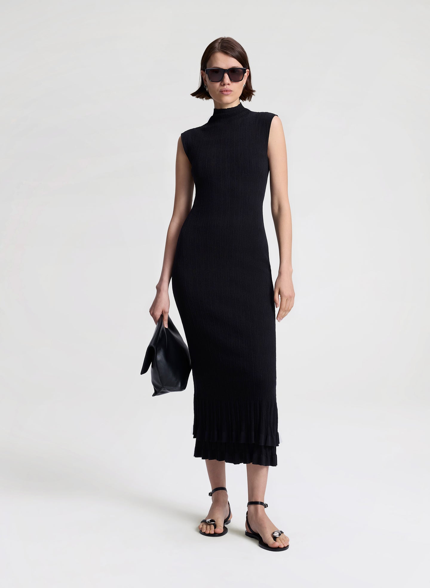 woman wearing black fine gauge voile knit midi dress