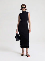 woman wearing black fine gauge voile knit midi dress
