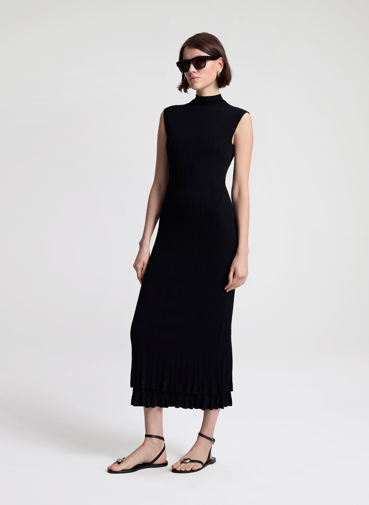 woman wearing black fine gauge voile knit midi dress