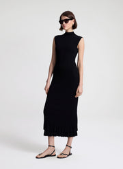 woman wearing black fine gauge voile knit midi dress