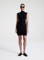 woman wearing black fine gauge voile knit mini dress