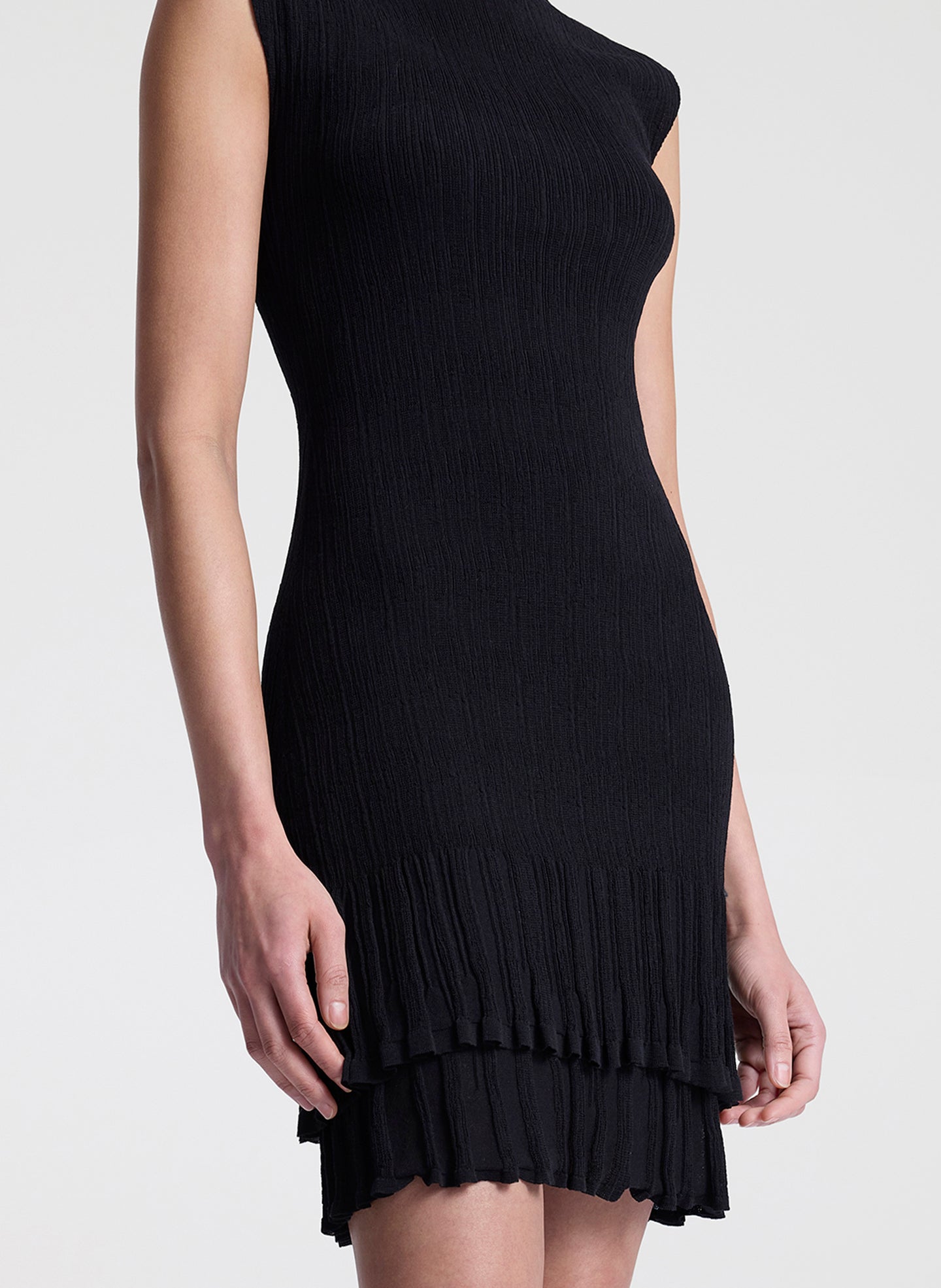 woman wearing black fine gauge voile knit mini dress