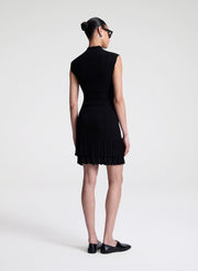 woman wearing black fine gauge voile knit mini dress