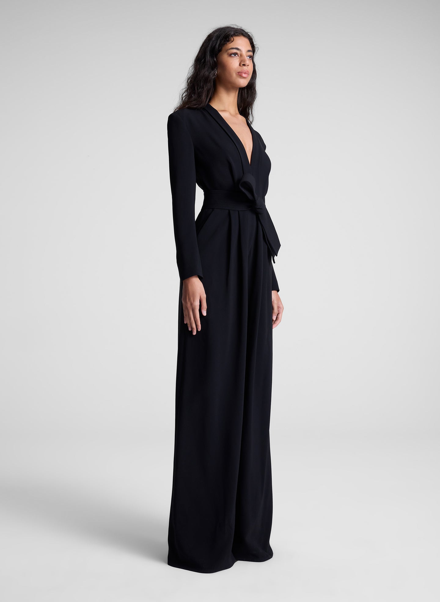 woman wearing black long sleeve jumpsuit