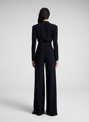 woman wearing black long sleeve jumpsuit