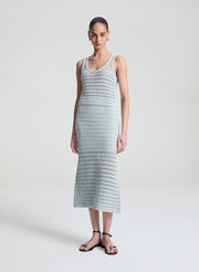 woman wearing light blue crochet tank and skirt set