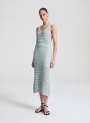 woman wearing light blue crochet tank and skirt set