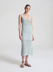 woman wearing light blue crochet tank and skirt set