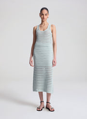 woman wearing light blue crochet tank and skirt set