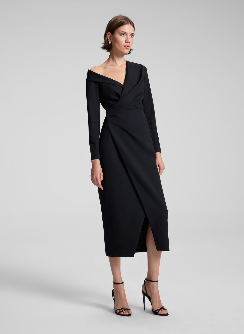 woman wearing black midi dress