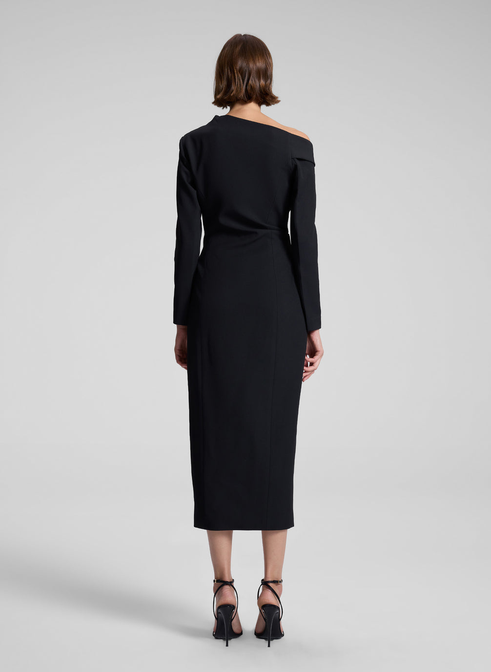 woman wearing black midi dress