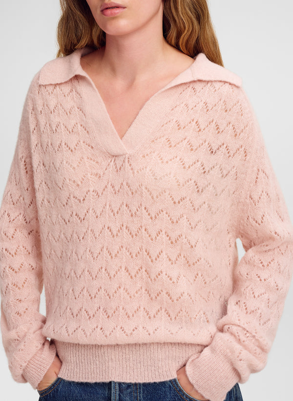 woman wearing pink collared sweater