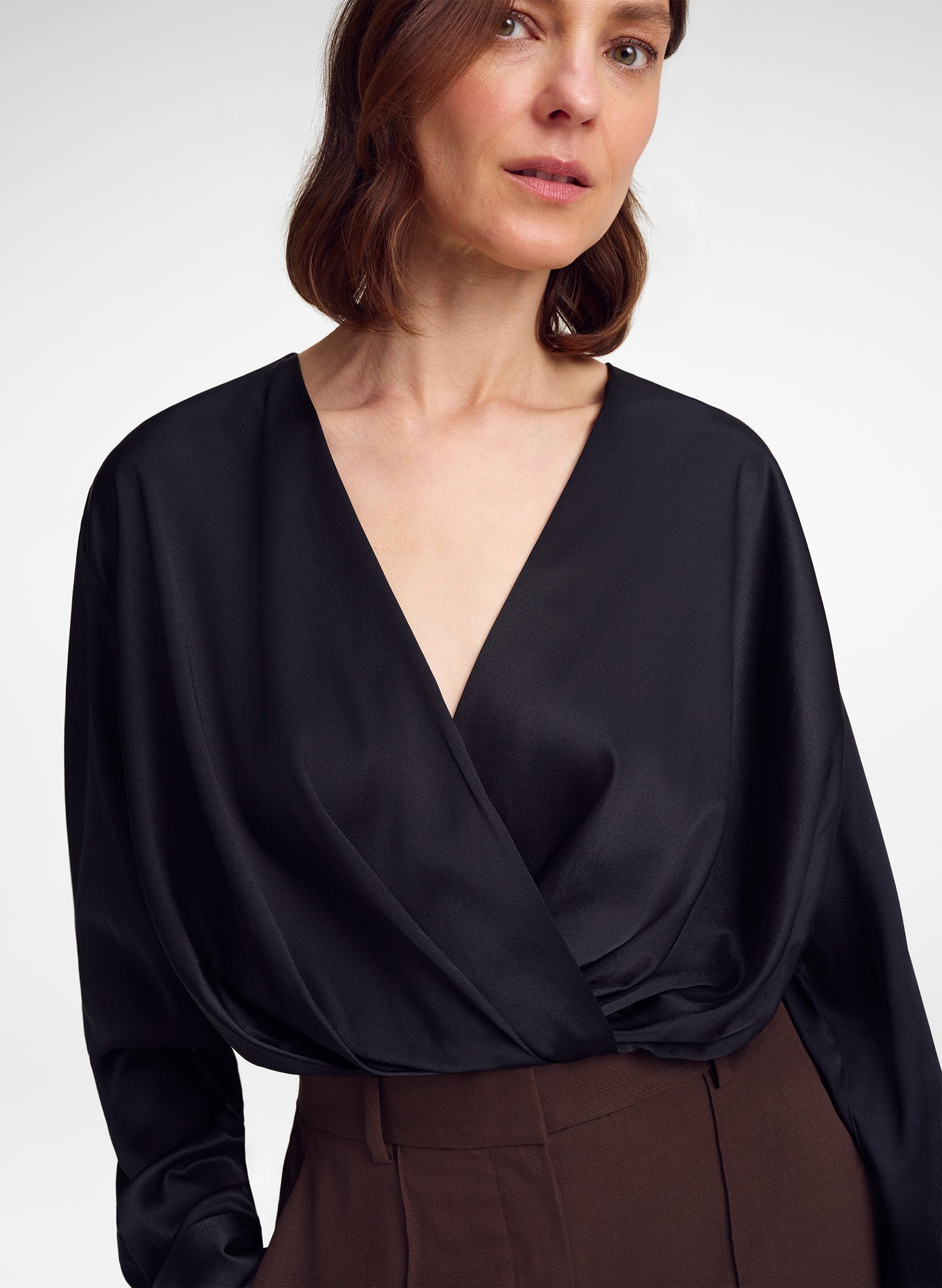 woman wearing black silk top