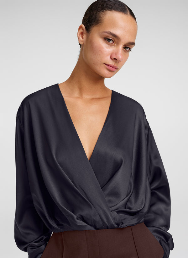 woman in black silk top