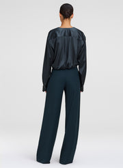 woman wearing green long sleeve top and green pants