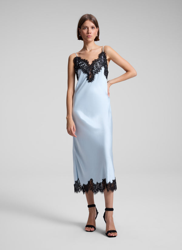 woman wearing blue and black lace slip dress