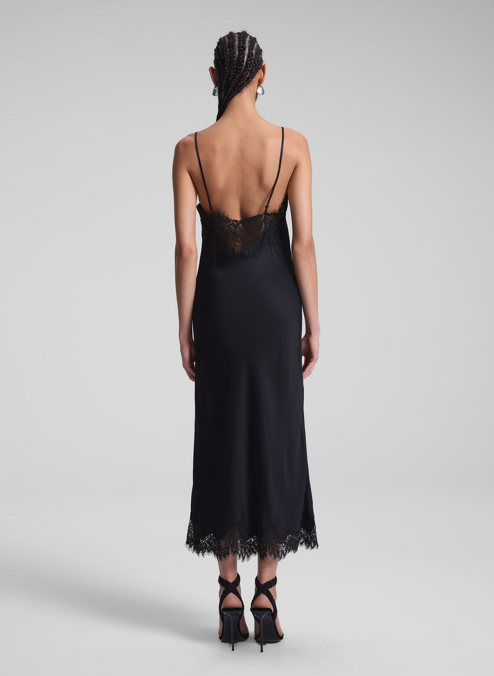 woman wearing black slip dress 