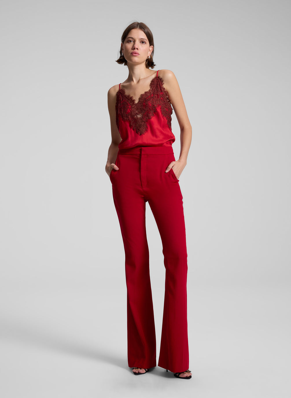 woman wearing red camisole an red pants