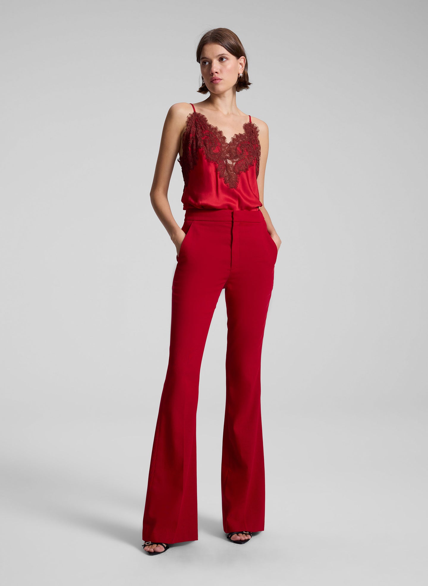 woman wearing red camisole an red pants