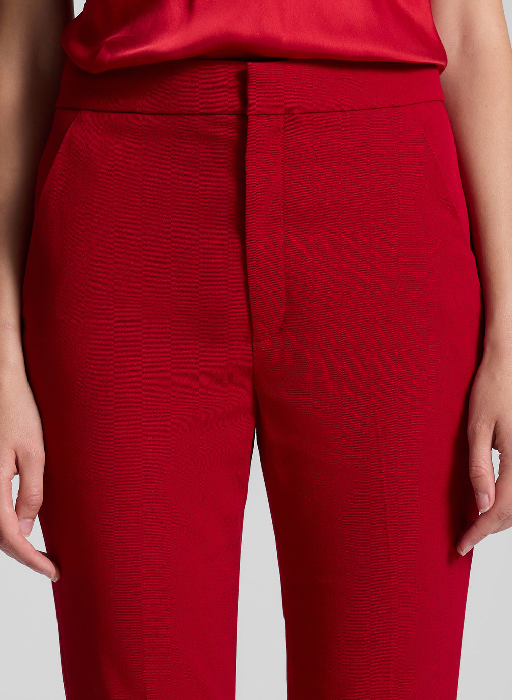 woman wearing red camisole an red pants