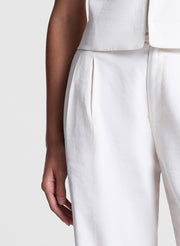 woman wearing beige vest and matching pants