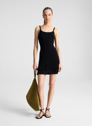 woman wearing black knit mini dress