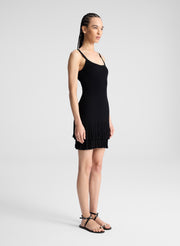 woman wearing black knit mini dress