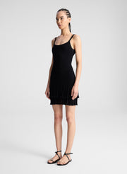 woman wearing black knit mini dress