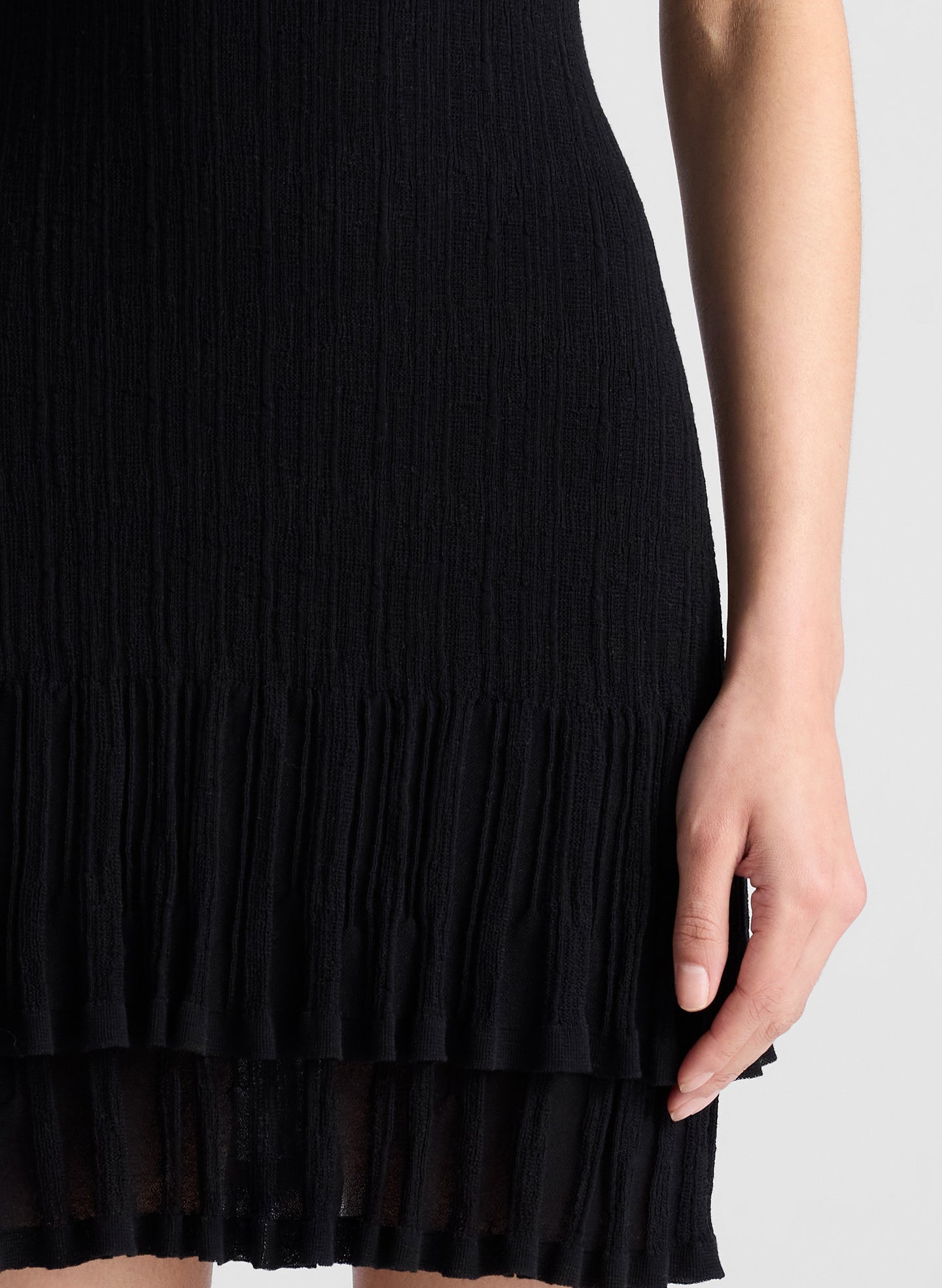 woman wearing black knit mini dress