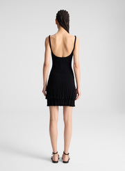 woman wearing black knit mini dress