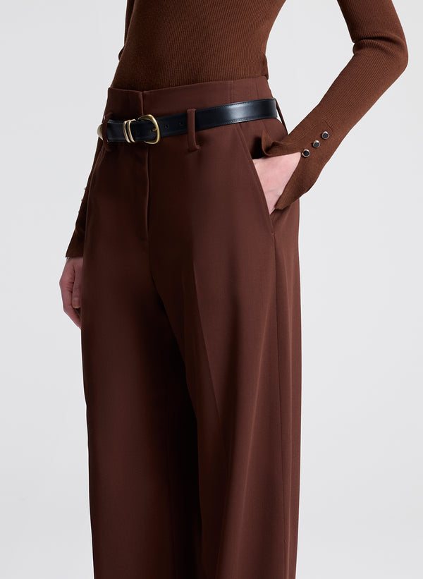 Brown pants with a belt on a white background