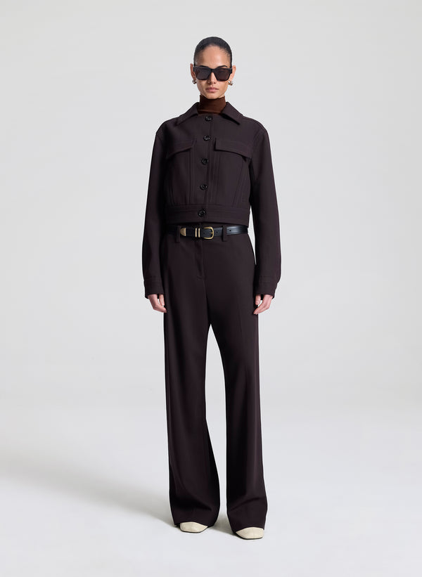 woman wearing dark brown jacket with matching dark brown pants